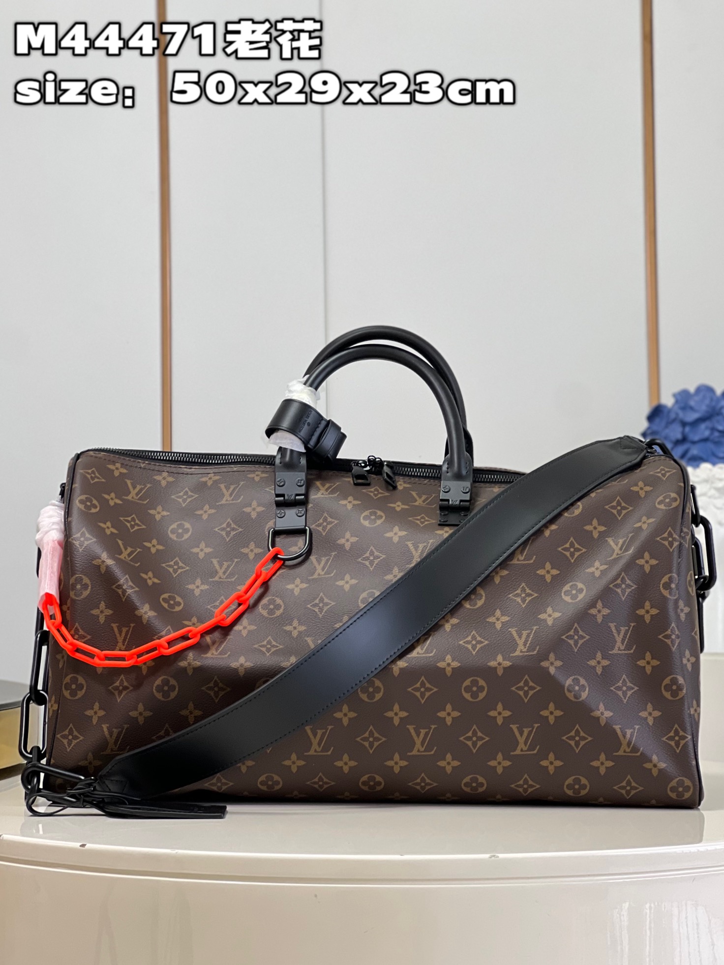 Louis Vuitton M44471 Iconic Monogram pattern with matte orange chain strapKEEPALL 50 travel bag