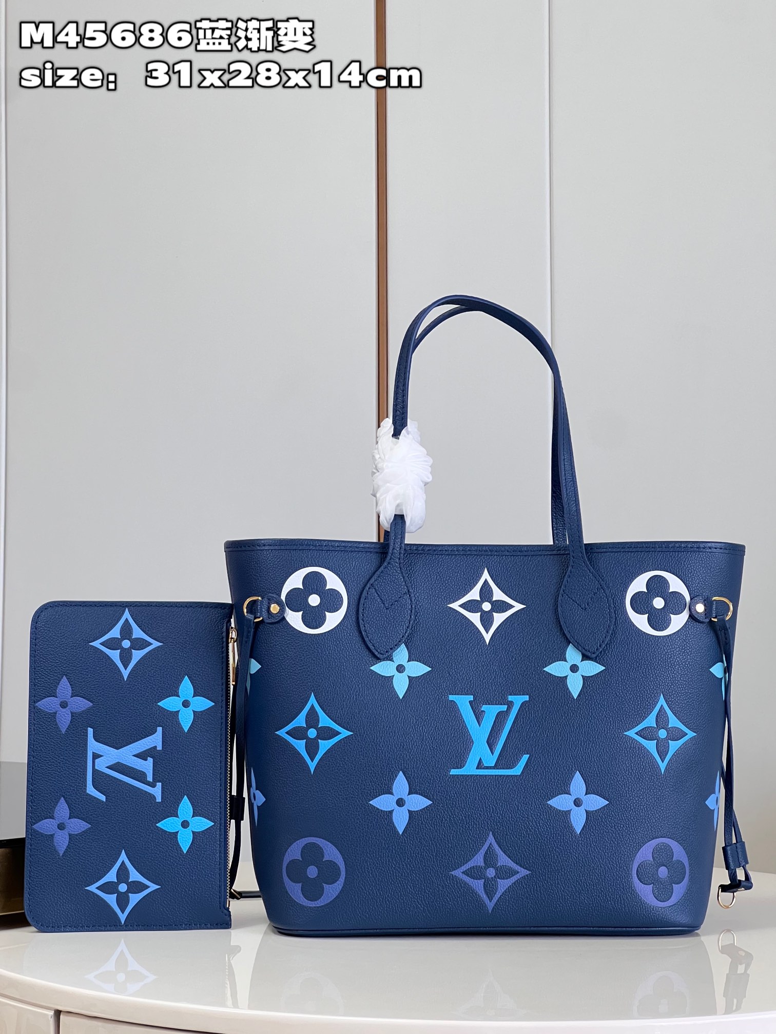 Louis Vuitton M45686 Neverfull medium blue gradient bag in Monogram Empreinte leather with large LV letters and Monogram flowers in gradient colors