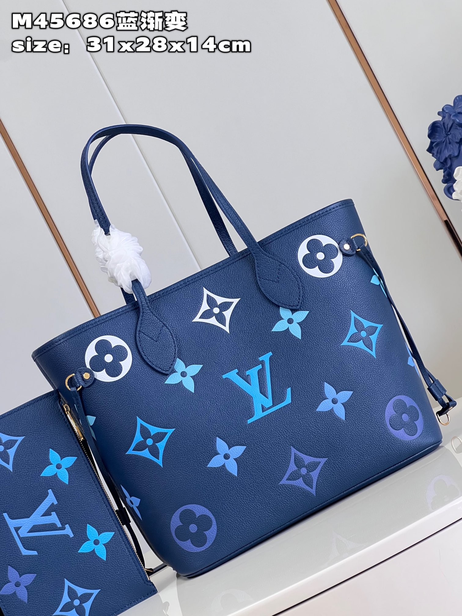 Louis Vuitton M45686 Neverfull medium blue gradient bag in Monogram Empreinte leather with large LV letters and Monogram flowers in gradient colors