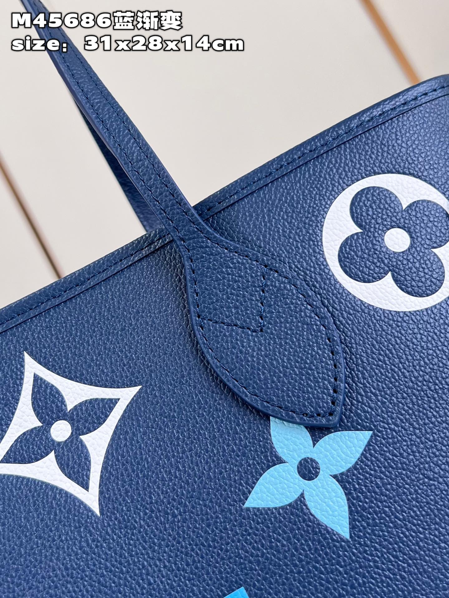 Louis Vuitton M45686 Neverfull medium blue gradient bag in Monogram Empreinte leather with large LV letters and Monogram flowers in gradient colors