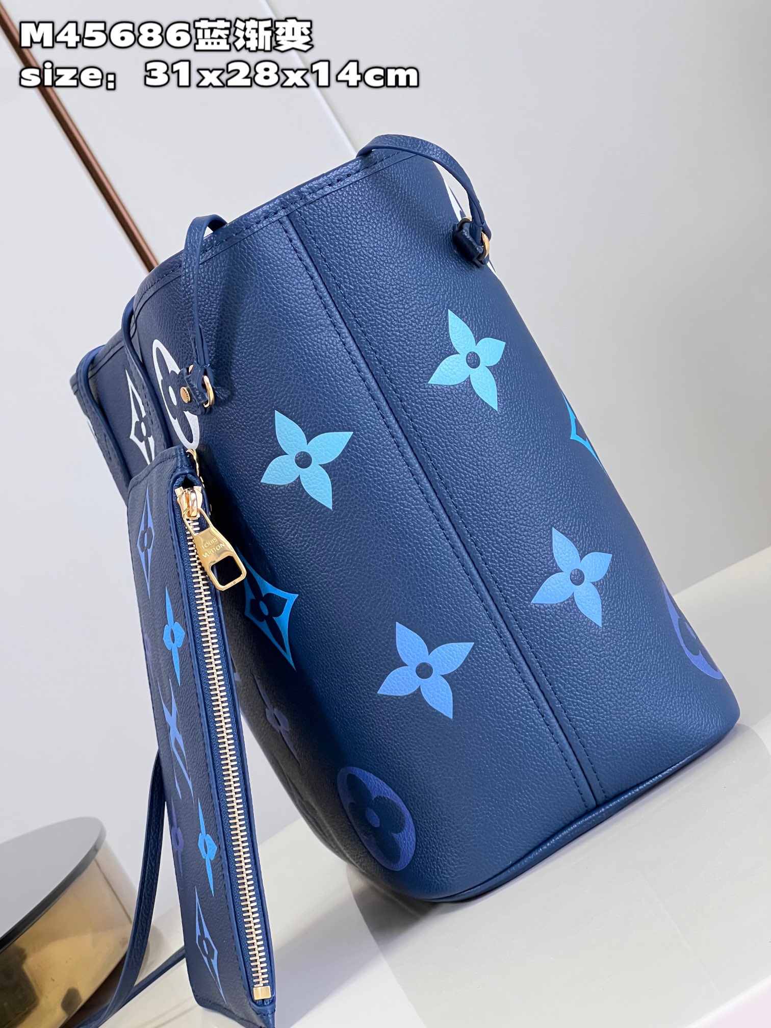 Louis Vuitton M45686 Neverfull medium blue gradient bag in Monogram Empreinte leather with large LV letters and Monogram flowers in gradient colors