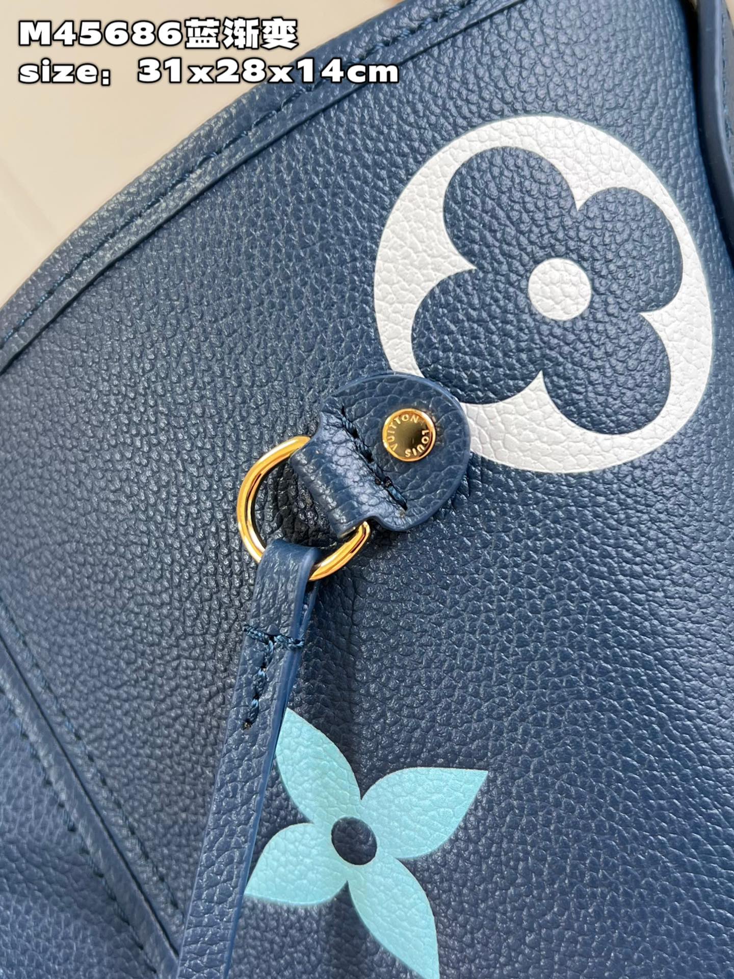 Louis Vuitton M45686 Neverfull medium blue gradient bag in Monogram Empreinte leather with large LV letters and Monogram flowers in gradient colors