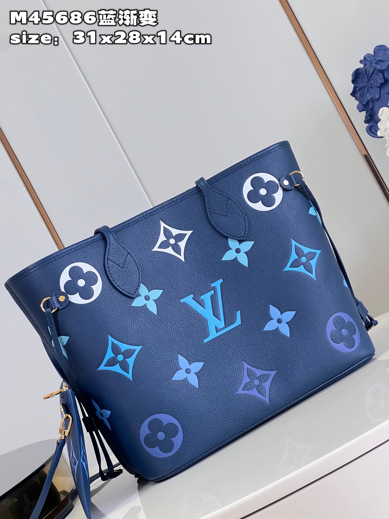 Louis Vuitton M45686 Neverfull medium blue gradient bag in Monogram Empreinte leather with large LV letters and Monogram flowers in gradient colors