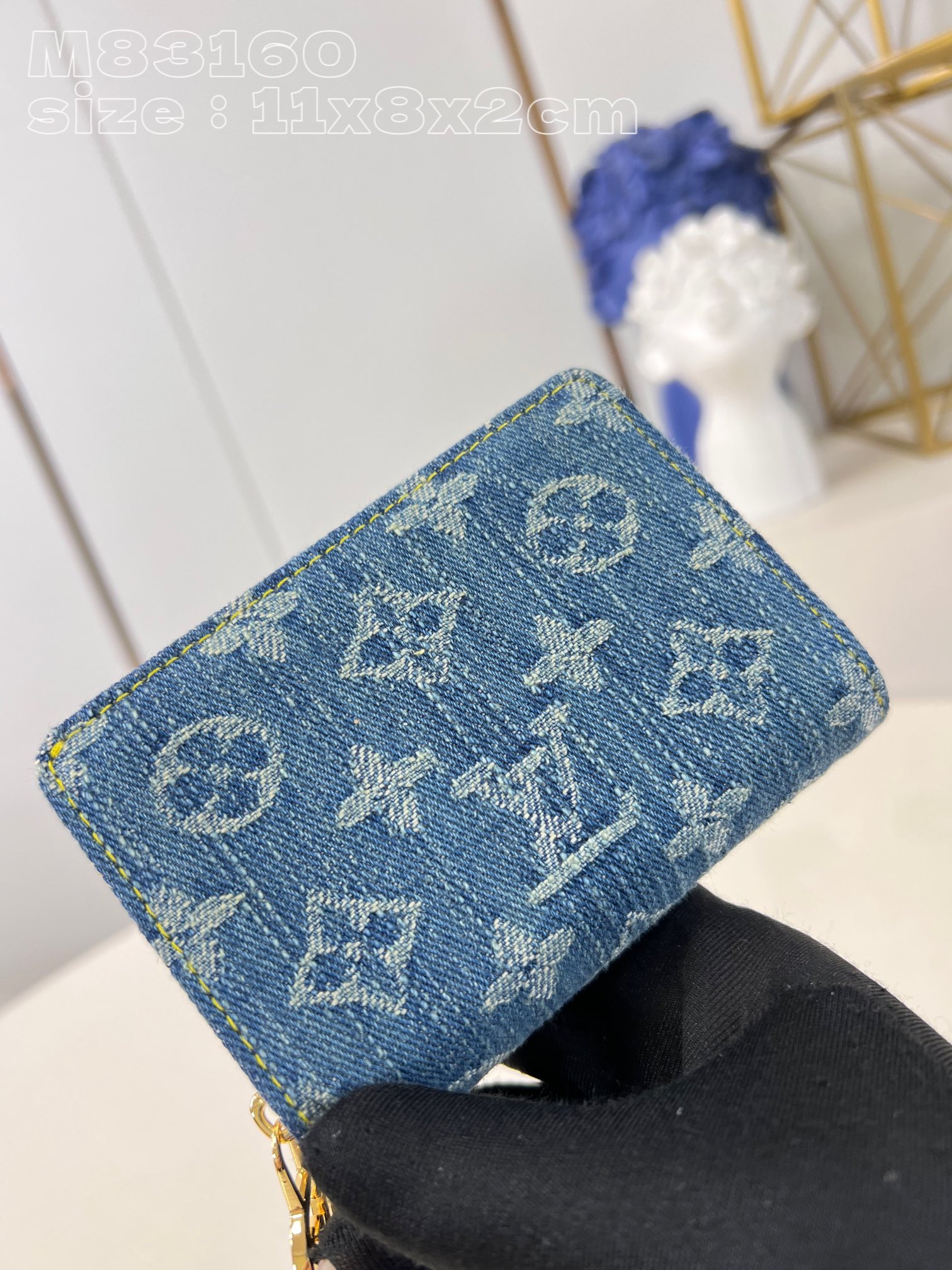 Louis Vuitton Denim wallet with Monogram print, gold-colored LV circle pull handle and zipper in the same color