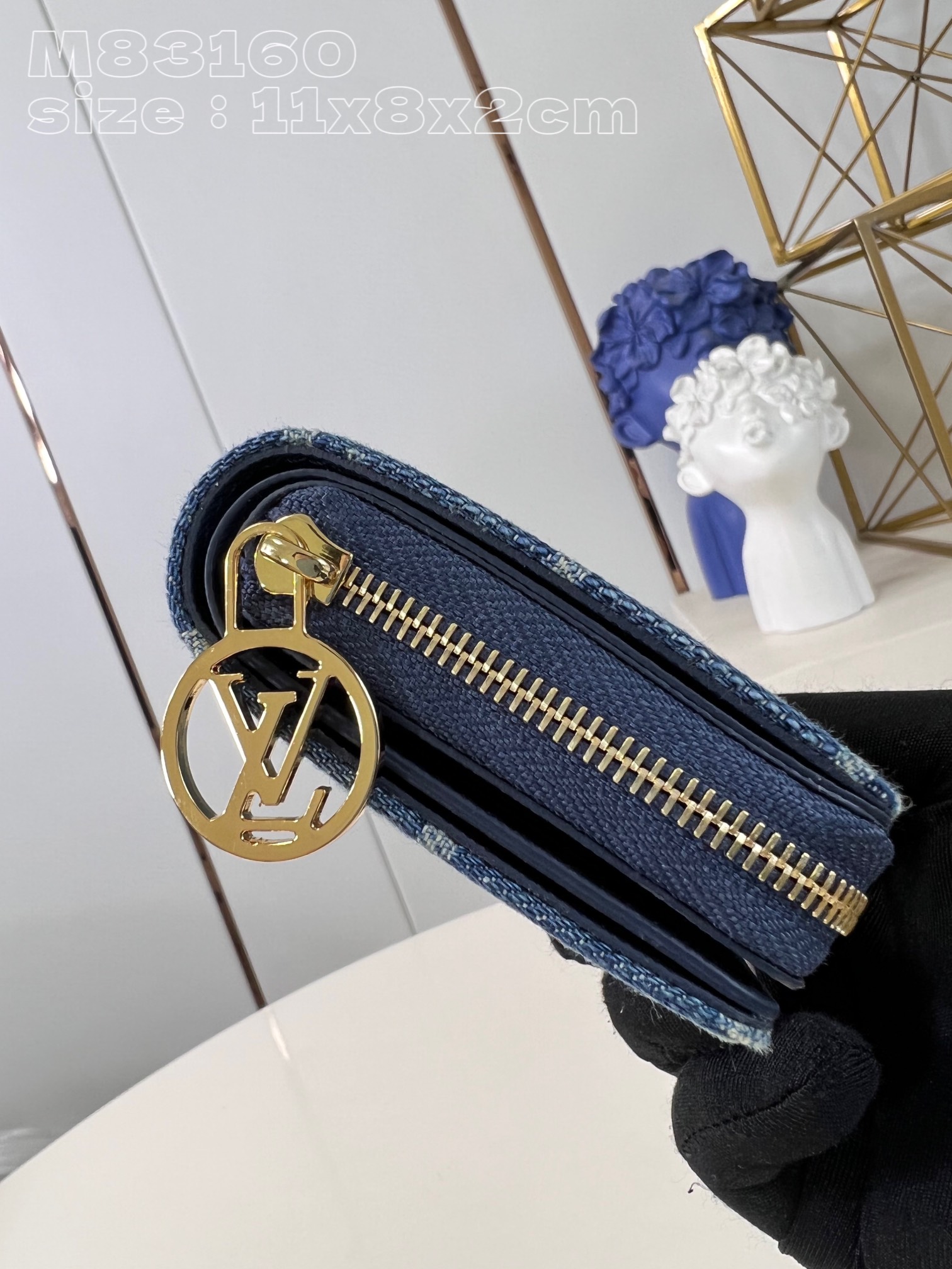 Louis Vuitton Denim wallet with Monogram print, gold-colored LV circle pull handle and zipper in the same color