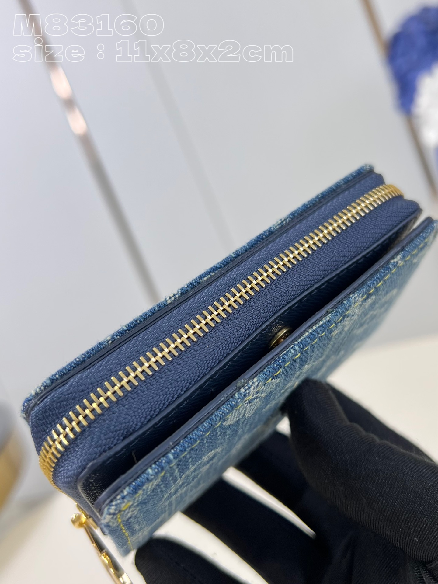 Louis Vuitton Denim wallet with Monogram print, gold-colored LV circle pull handle and zipper in the same color