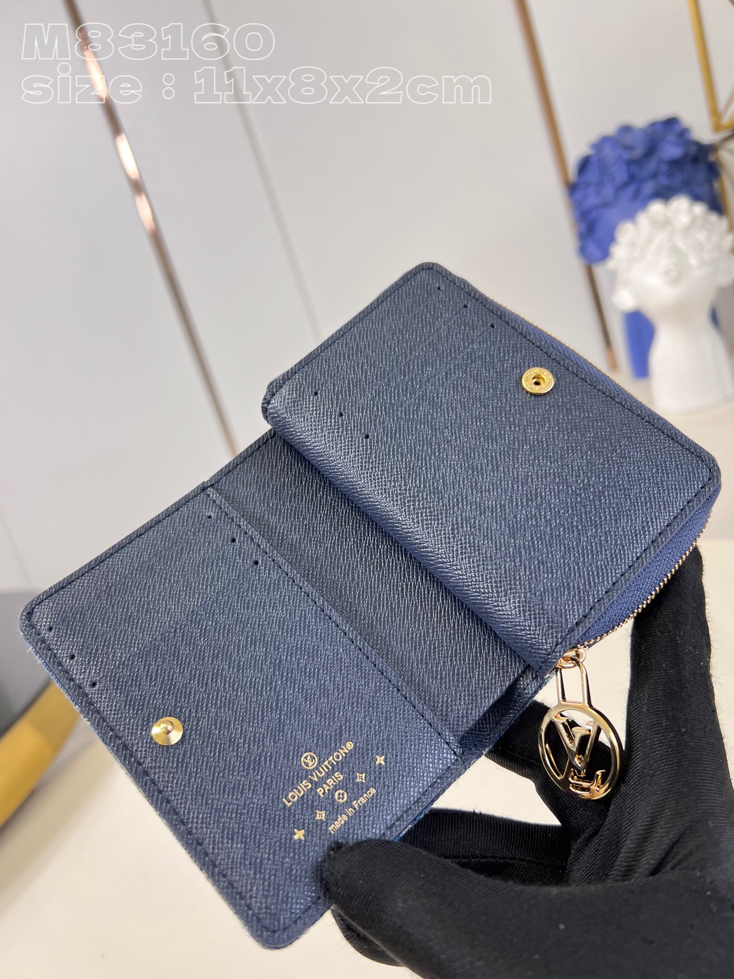 Louis Vuitton Denim wallet with Monogram print, gold-colored LV circle pull handle and zipper in the same color